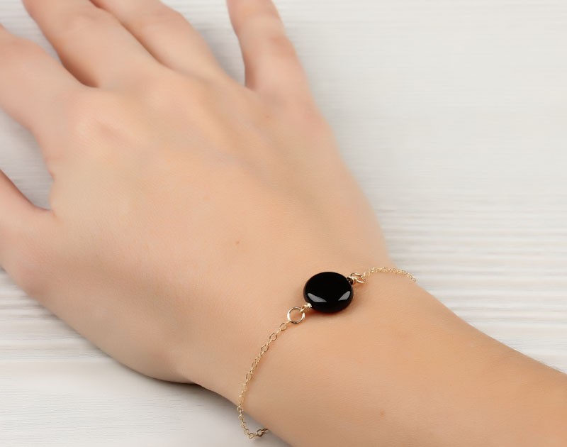 Gold bracelet discount with black stones